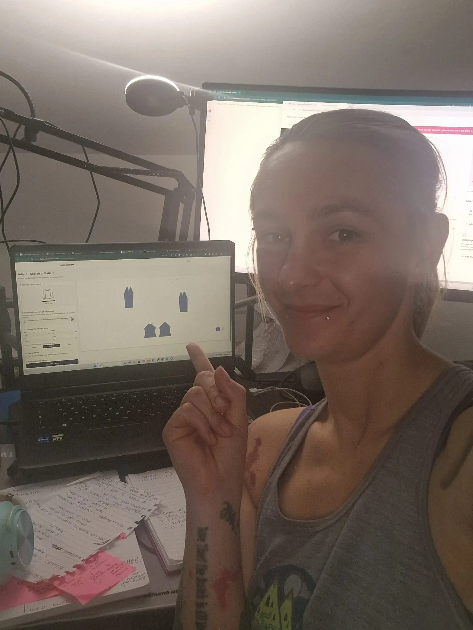 Woman Demonstrating Fashion Sketch-to-Pattern Software on Laptop