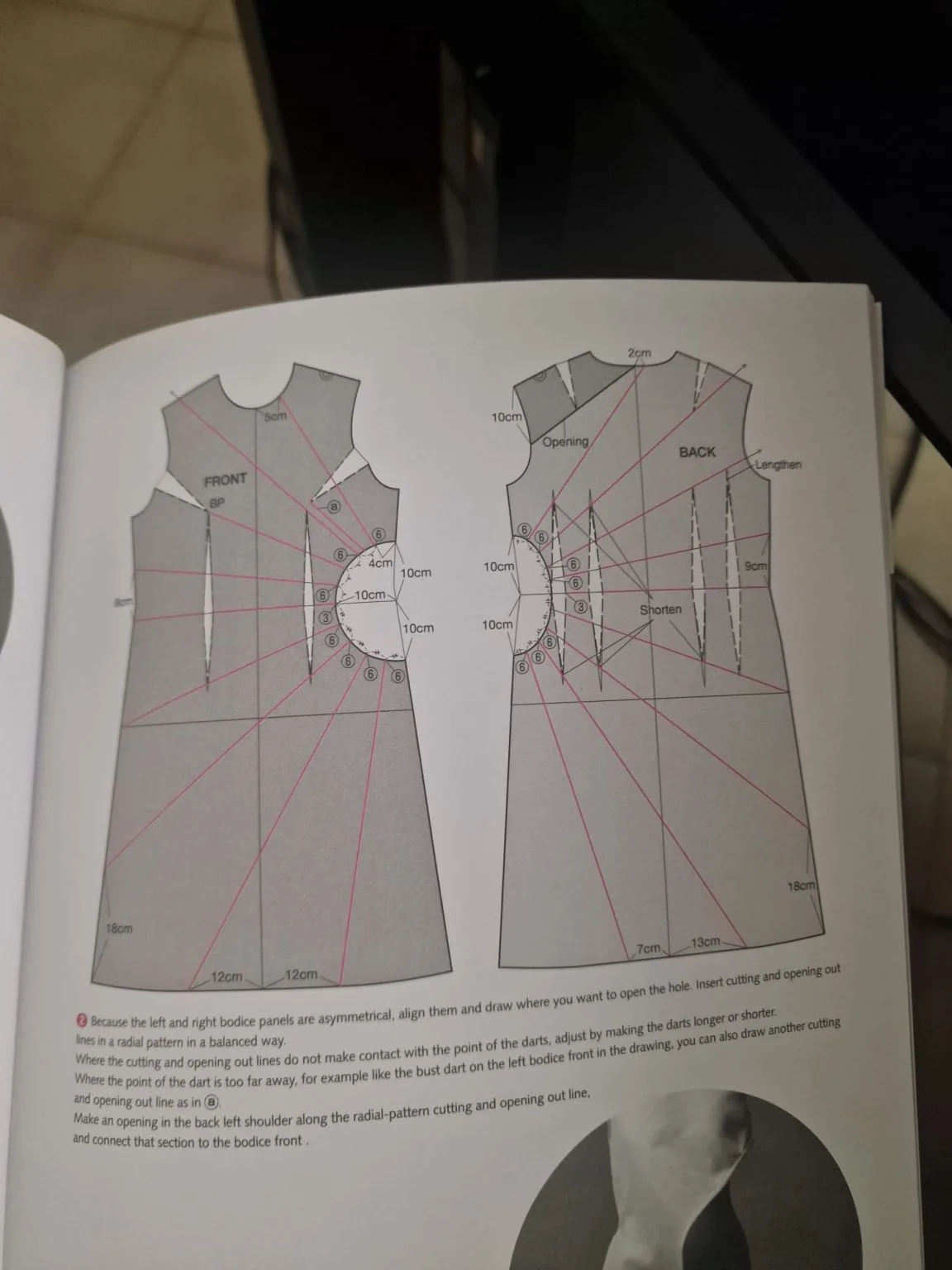 An open fashioninsta_AI book displays intricate grey bodice patterns for front and back, illustrating radial cutting lines, dart adjustments, and specific measurements for garment construction.