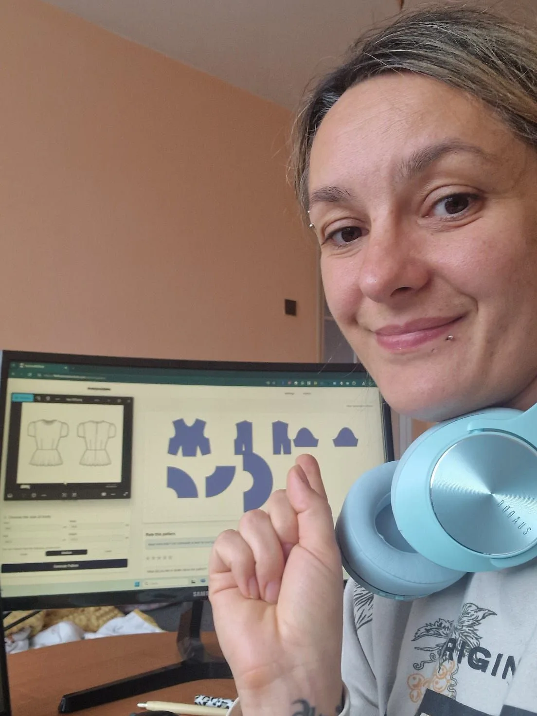 Woman Working with Fashion AI Tool Displayed on Computer Monitor