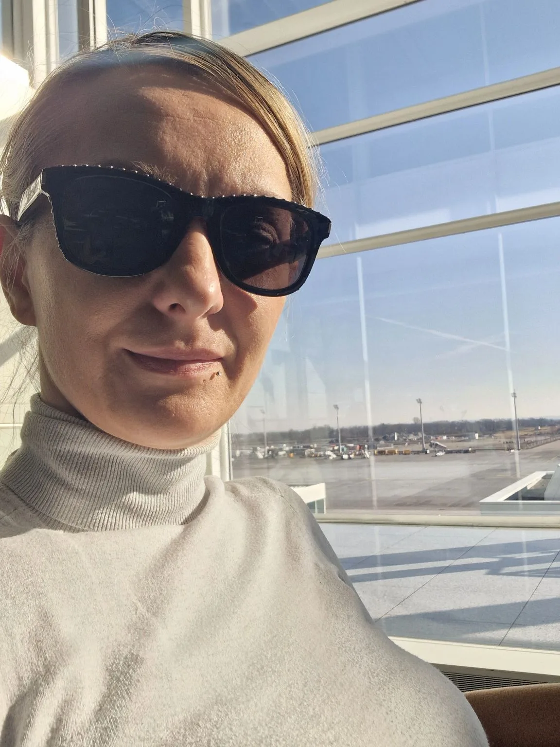 Woman Working with Fashion AI Tool Displayed on Computer Monitor